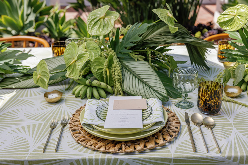 place setting with green foliage centerpieces