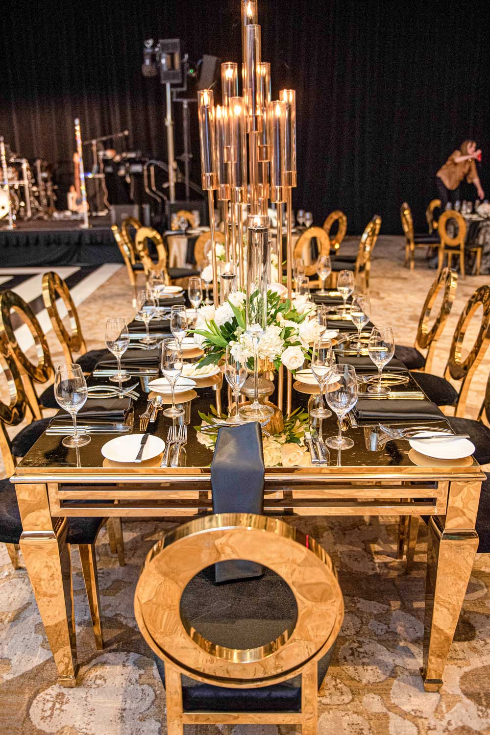 large rectangular gold table set for event